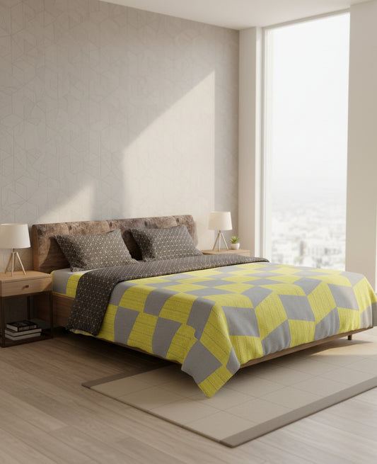 Bedroom with a bed featuring a yellow and gray checkered blanket.
